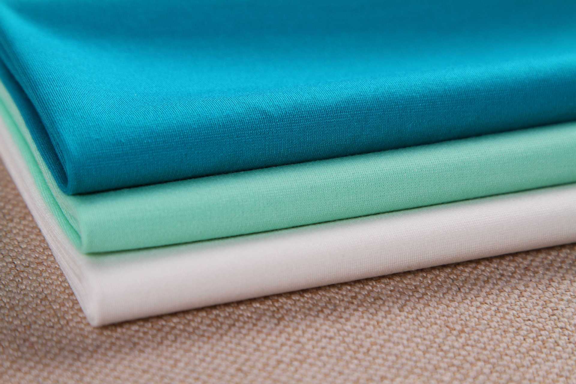 厂家现货直销弹力平纹棉锦针织布 时尚锦包棉女装服装裤子面料