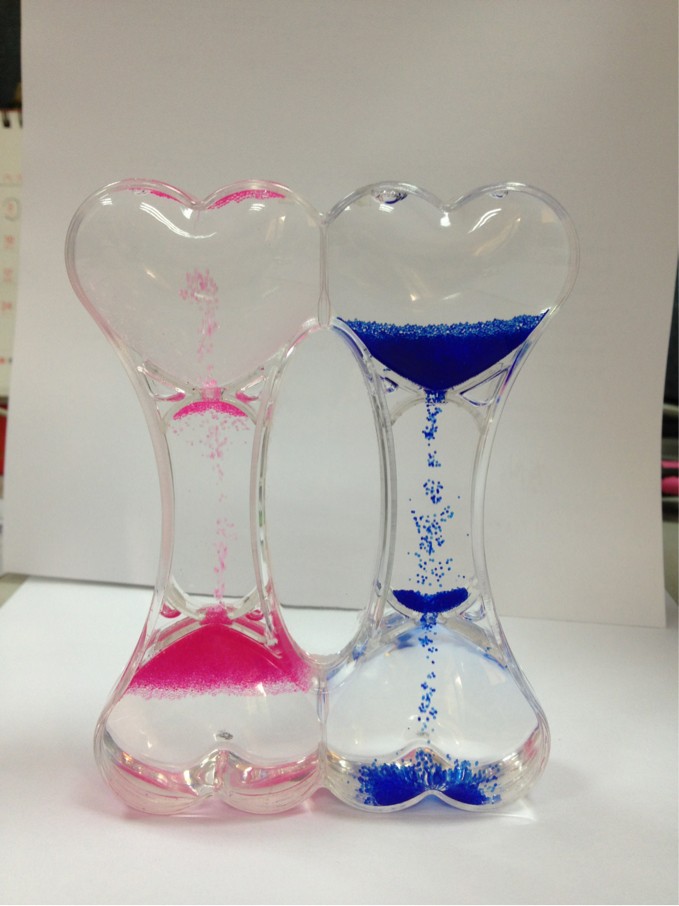 厂家供应入油水压克力双向沙漏 新奇特动感油滴漏 骨头型沙漏滴漏