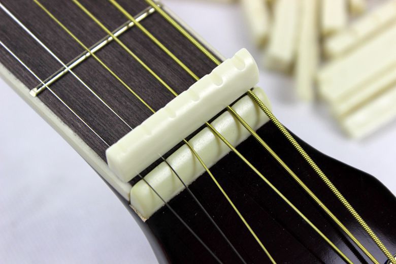 吉他通用琴枕琴桥民谣电箱木吉它高仿真牛骨弦桥弦枕jita上弦枕