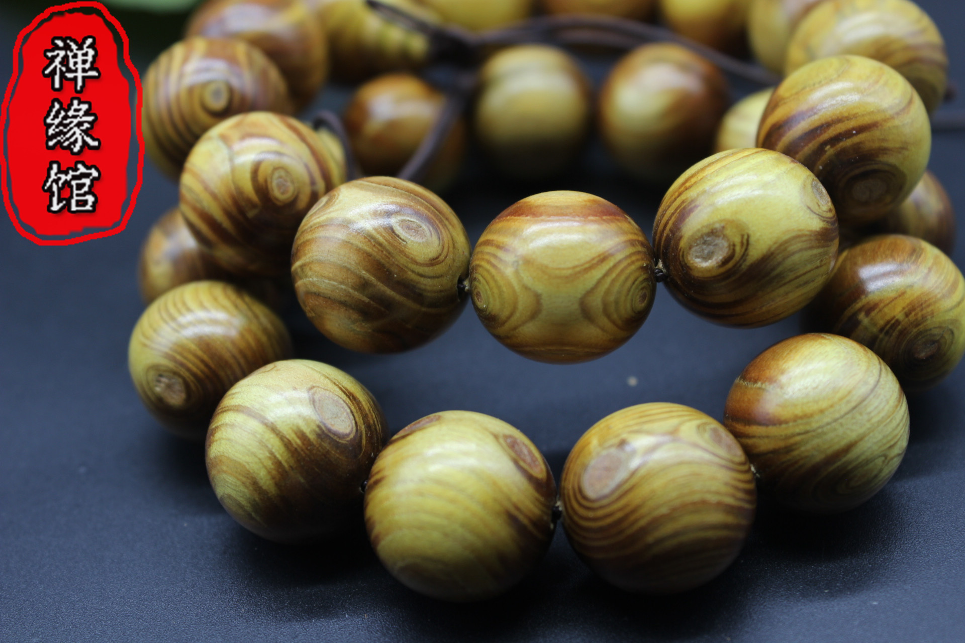 艺国行热卖黄金柚木对眼鬼脸佛珠手串手链厂家