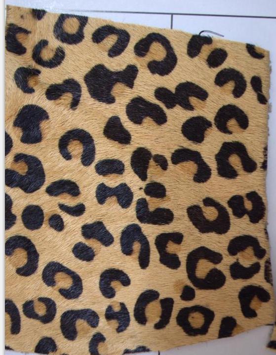 厂家供应真皮马毛印花皮料带毛皮网印豹花皮