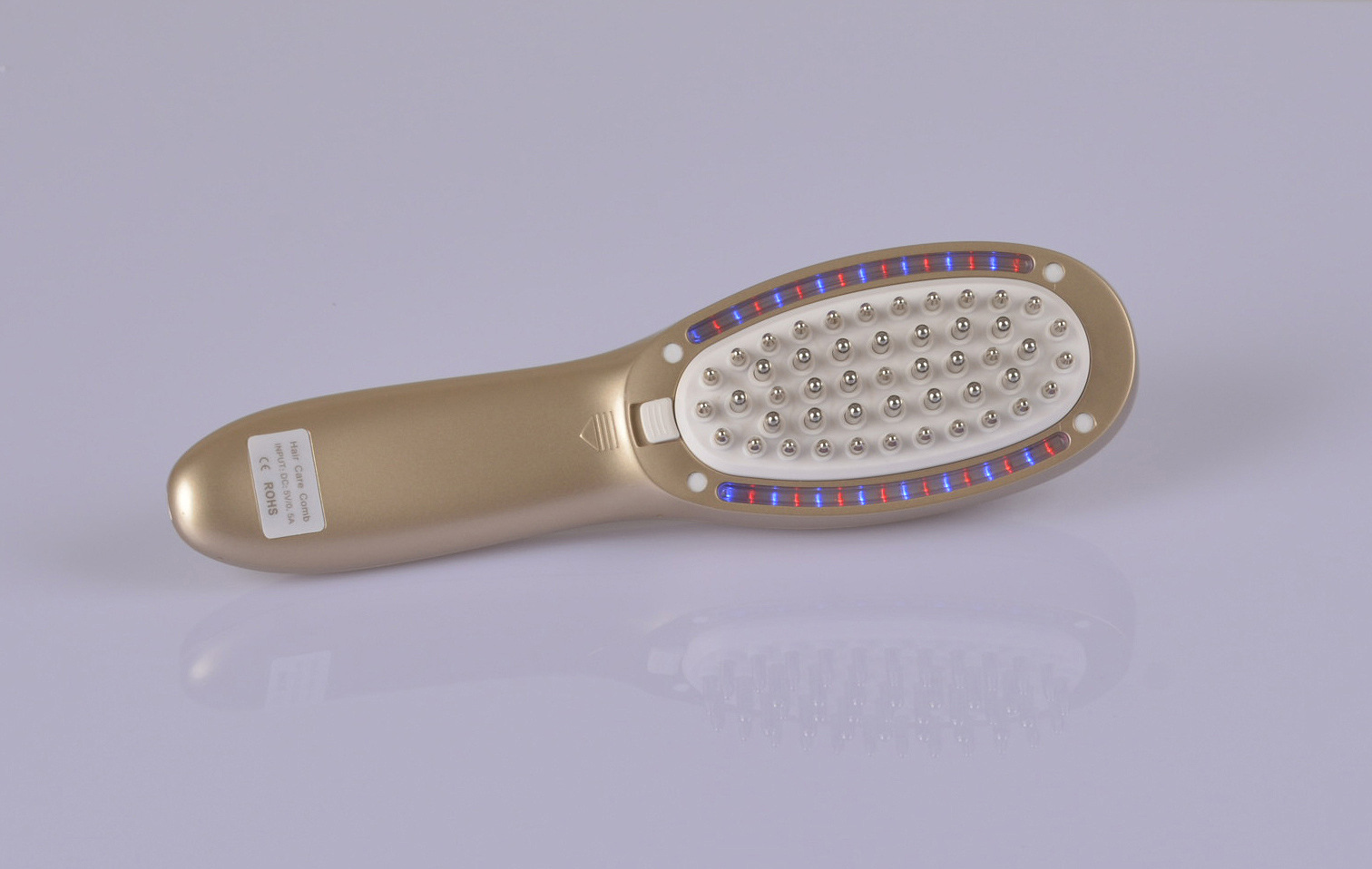 供应激光生发梳头皮按摩梳子彩光导入导出防脱上药护发梳震动电动