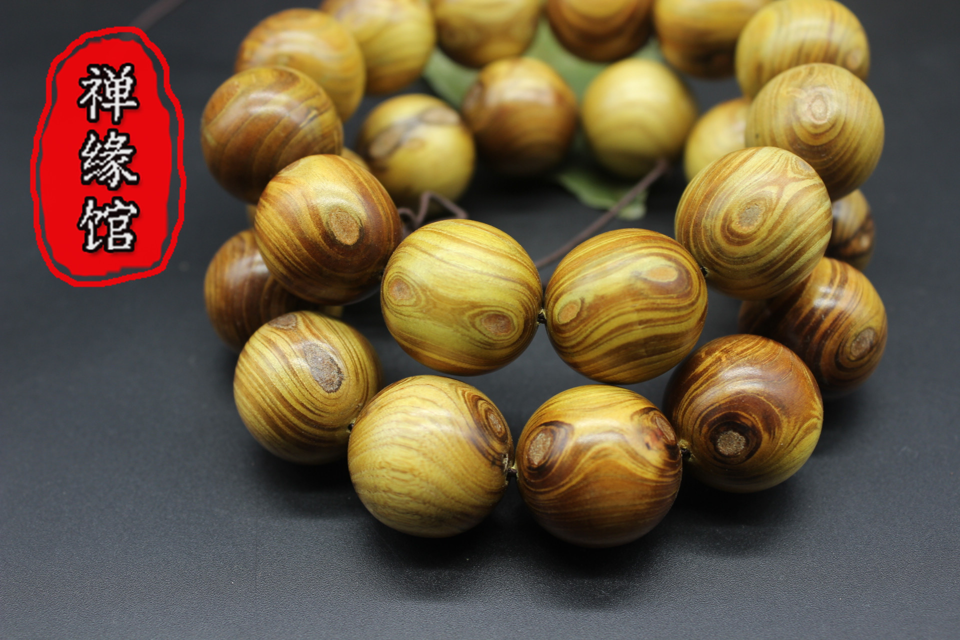 艺国行热卖黄金柚木对眼鬼脸佛珠手串手链厂家