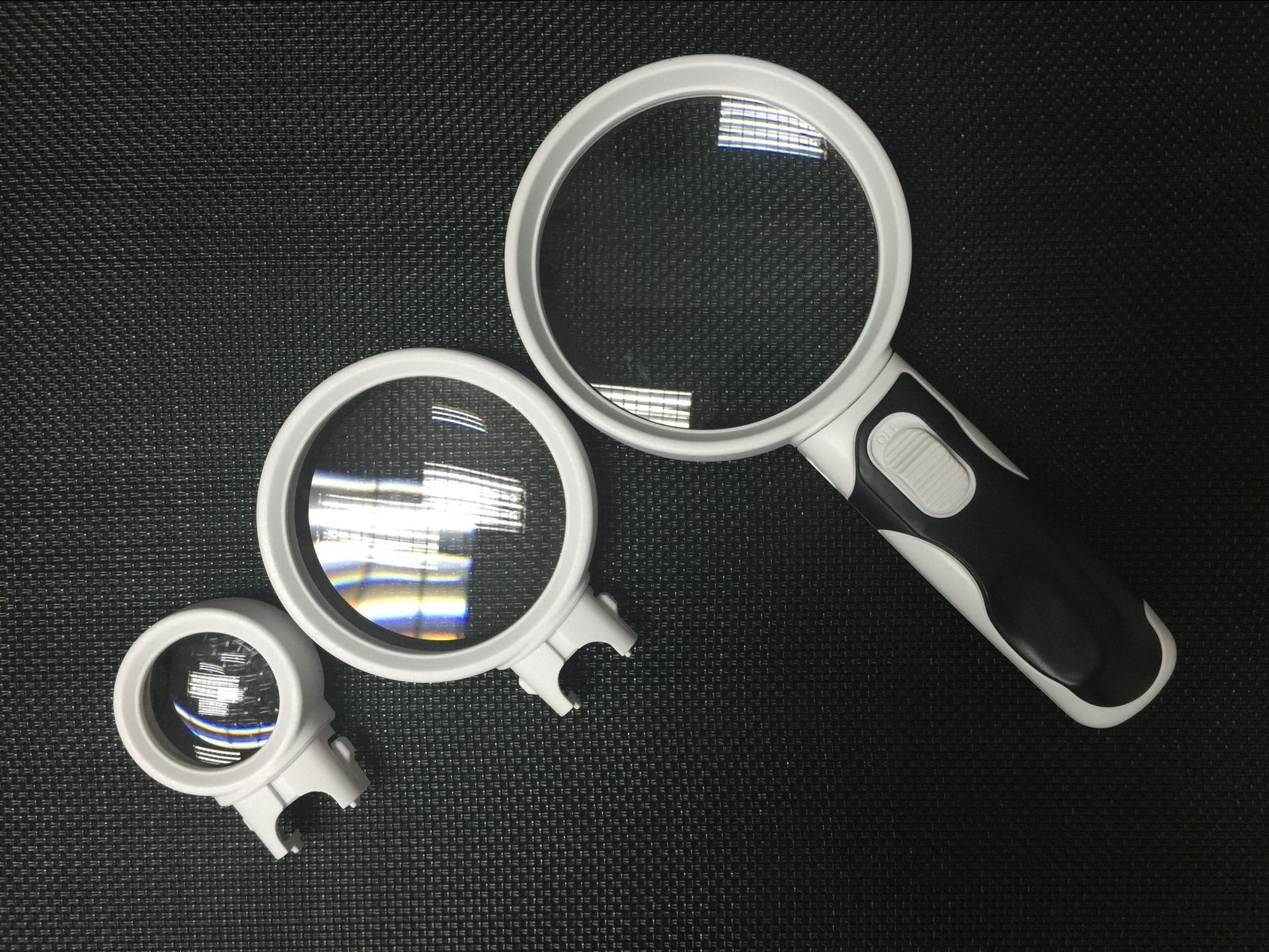 新款手持带2led灯阅读放大镜 三镜头可