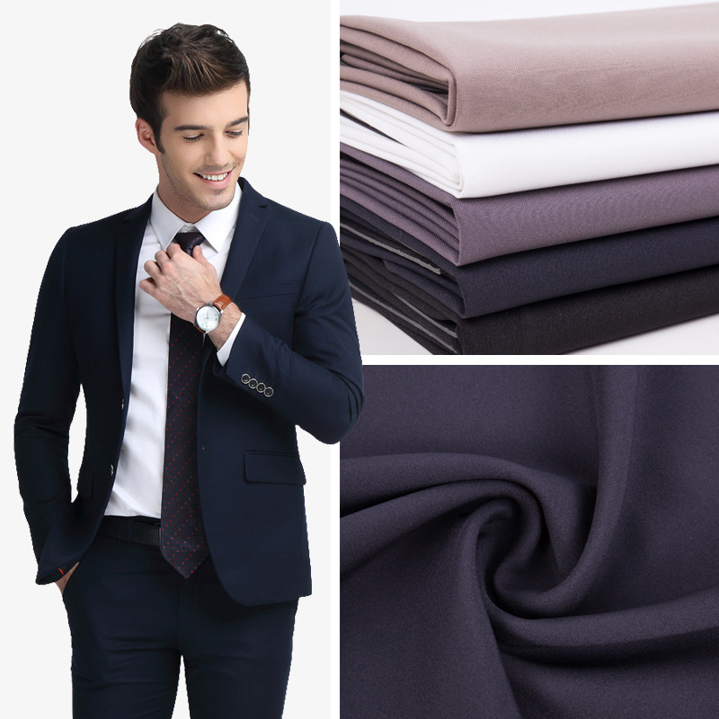 现货批发全涤哔叽西装面料男斜纹涤纶染色工作服装饰布布料供应