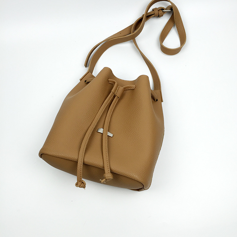 2016荔枝纹抽带水桶包女 纯色休闲包中包 全pu女包仿皮个性女包