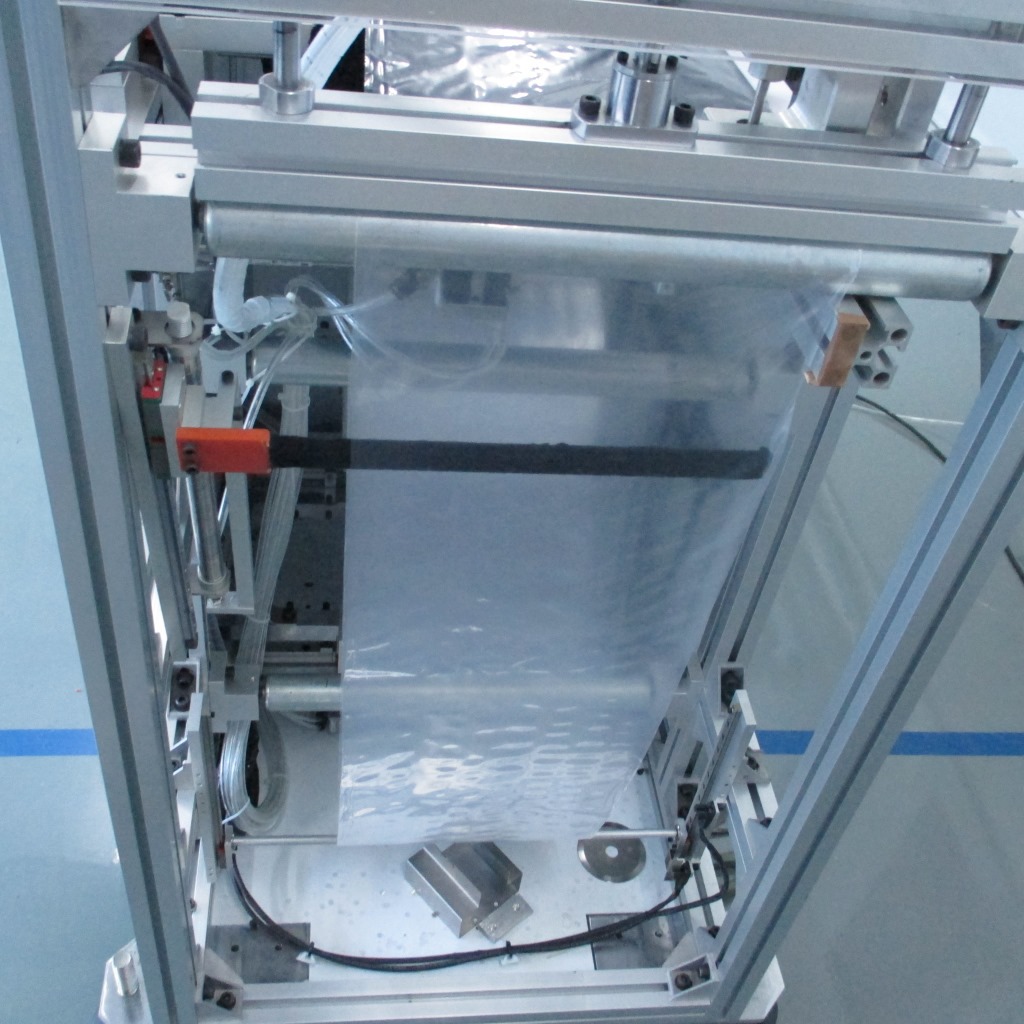 【工厂直销】音乐贺卡自动包装机pe薄膜自动封切打孔成袋书本包装