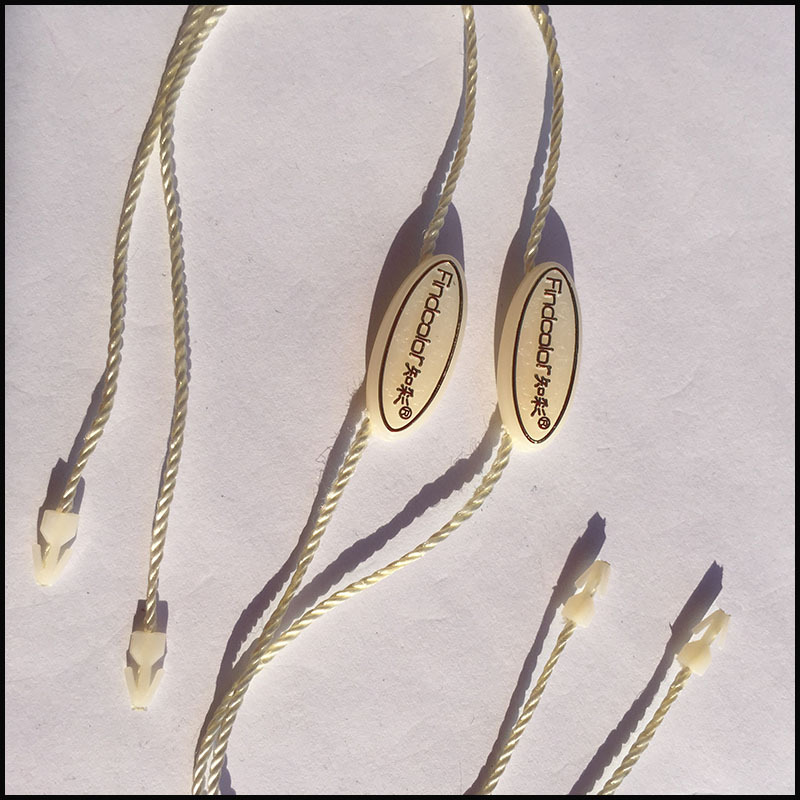 双插吊绳吊粒订做 高档品牌服装烫金塑料米色吊粒定做 免费设计