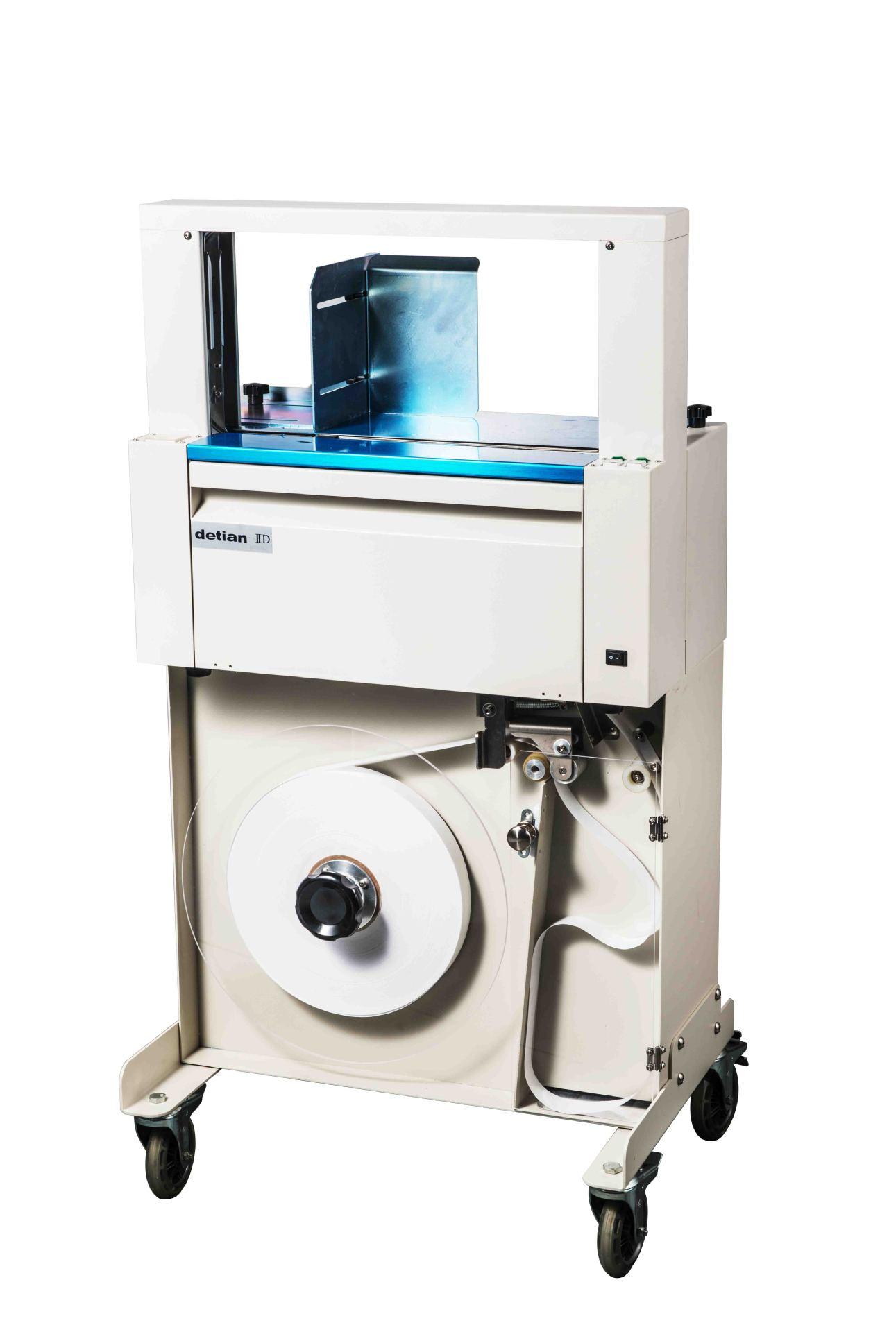 全自动束带机纸带打包机纸带牛皮纸带卡片纸盒打捆机扎把机扎带机