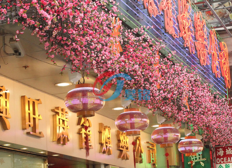 春节商场布置 仿真桃花树 仿真花型拱门 商场中庭dp景点装饰
