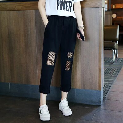 2017春夏新款韩版松紧腰大破洞网格拼接休闲九分裤女宽松黑色显瘦