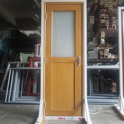 厂家批发新型板门加工定制木纹色塑钢平开门卫生间海螺pvc塑料门