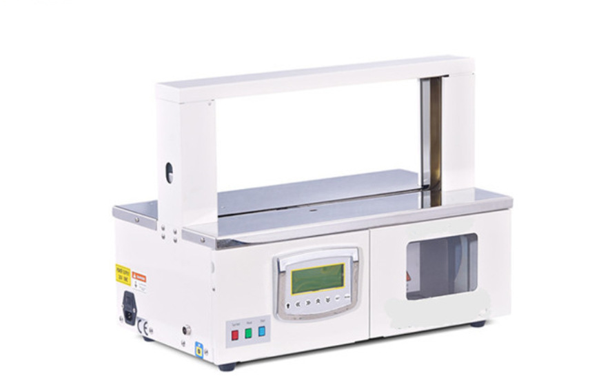 厂家直销opp膜束带机 自动纸带捆钞机 透明膜扎把机