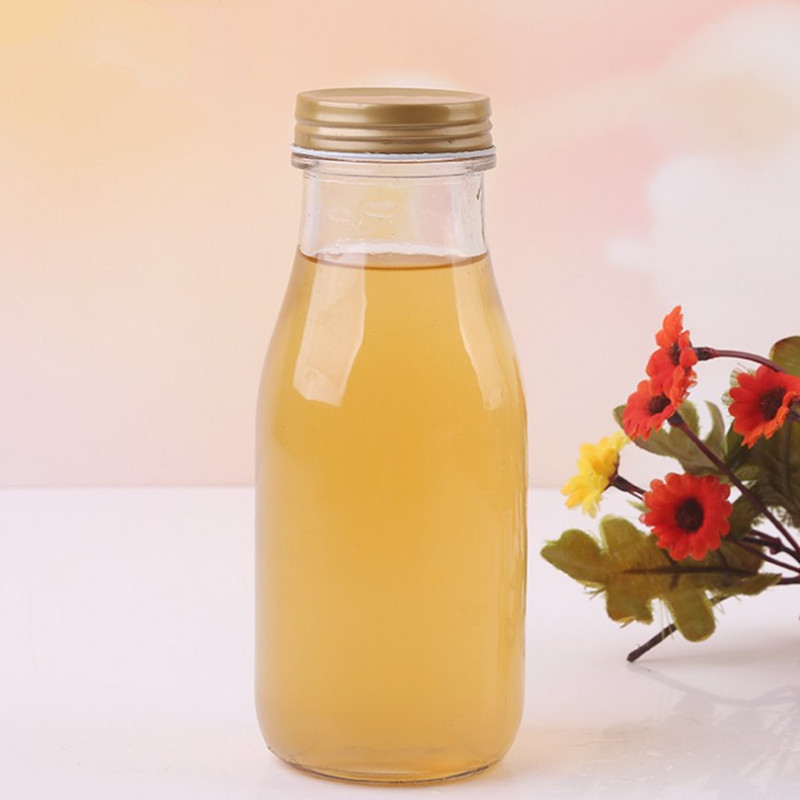 厂家直销高档透明玻璃300饮料瓶 半丝螺旋盖 创意玻璃饮料瓶定制