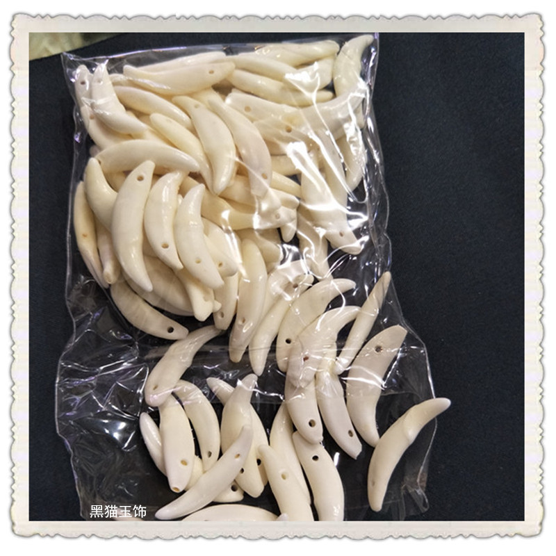 狗牙工艺品吊坠批发 清洗漂白中号狗牙挂件销售 地摊夜市适合佩戴