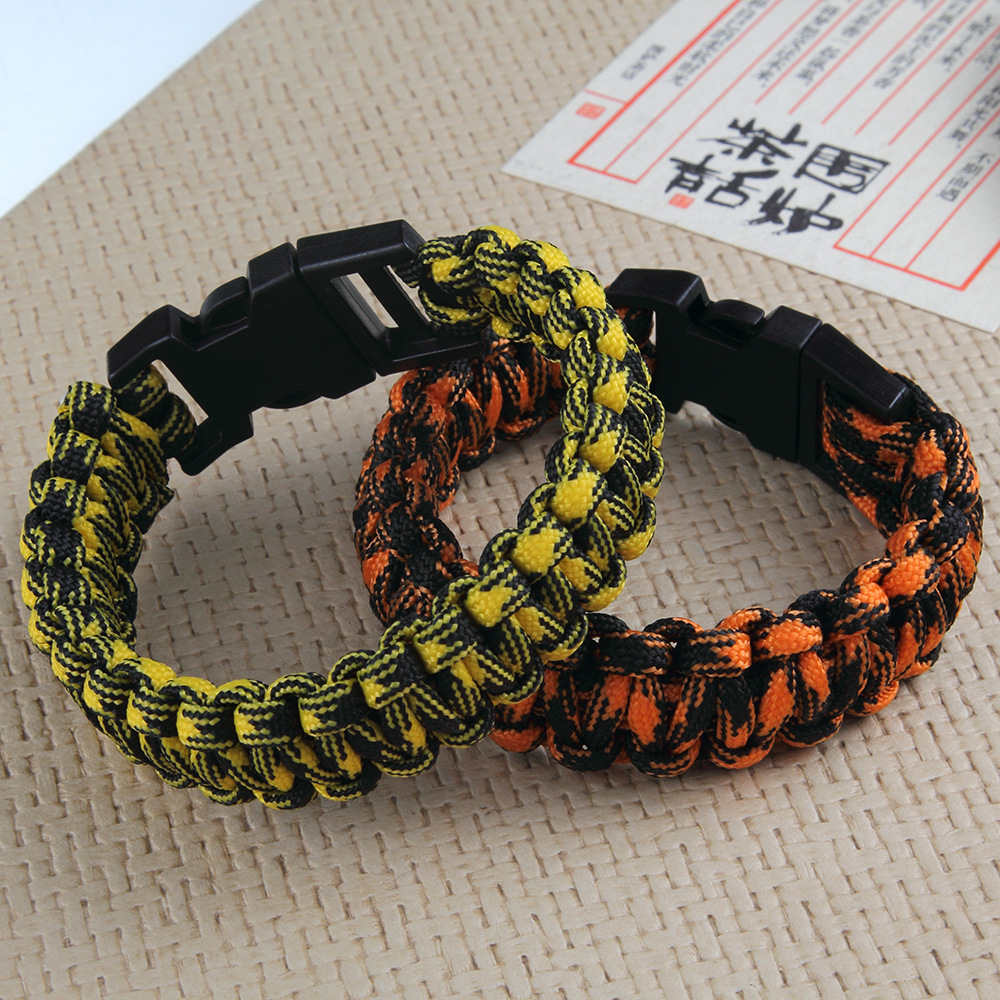 速卖通热销户外运动饰品 个性彩色绳编织塑料扣手链 救生伞绳首饰