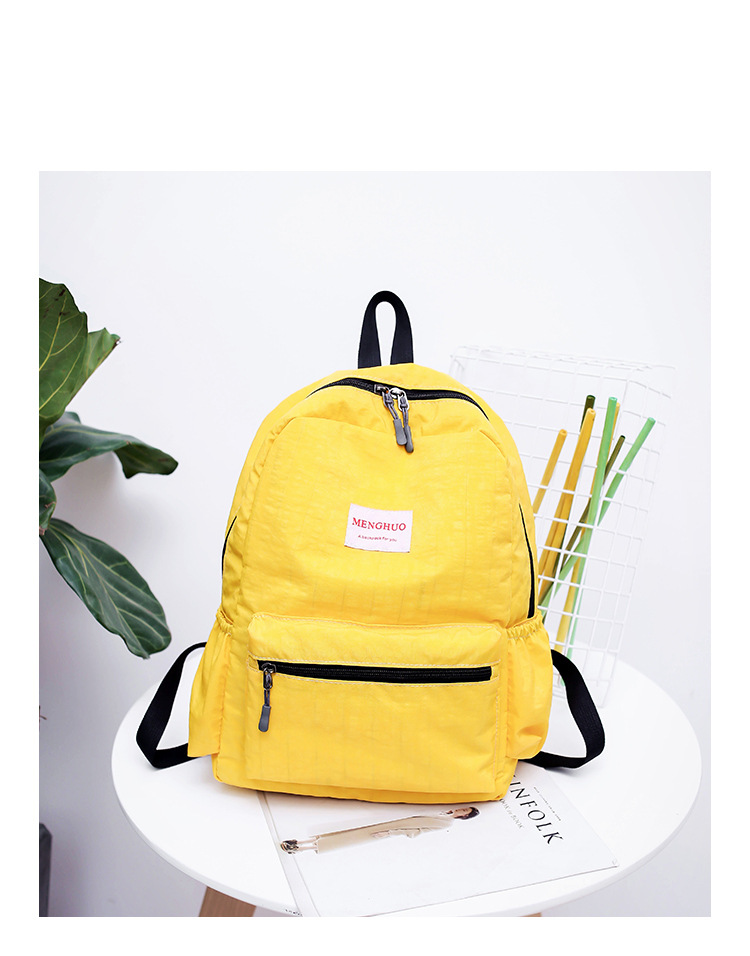menghuo原宿时尚纯色贴标防水百搭软妹学生背包女双肩包学生包