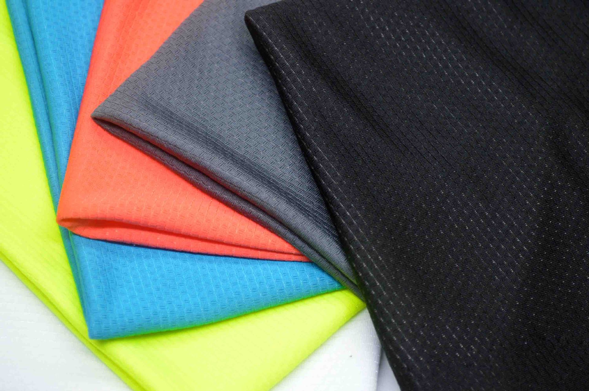 丙纶针织提花网眼布 单向导湿面功能性单向导湿针织面料现货供应