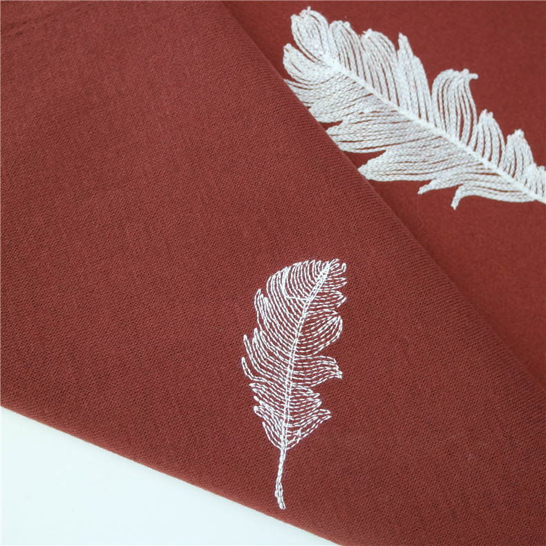 现货供应 秋冬新品鑫宝呢羽毛绣花毛呢面料 女装呢大衣外套服装面