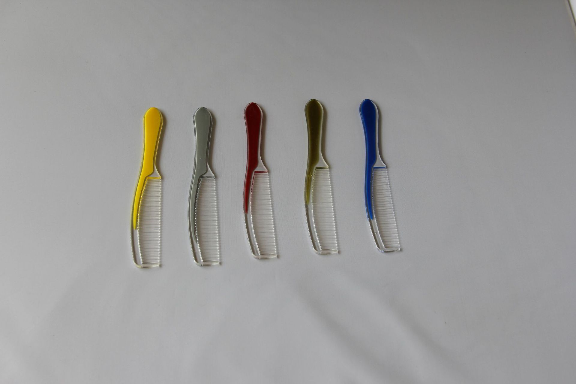 一次性时尚弯把梳