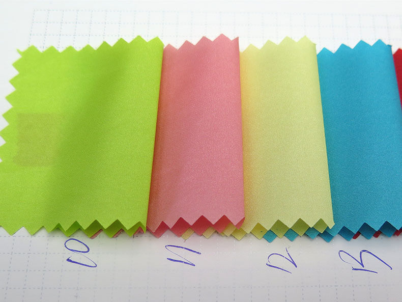 【厂家直销】40d尼龙三角有压过胶面料 pu透明胶防绒防水棉衣面料