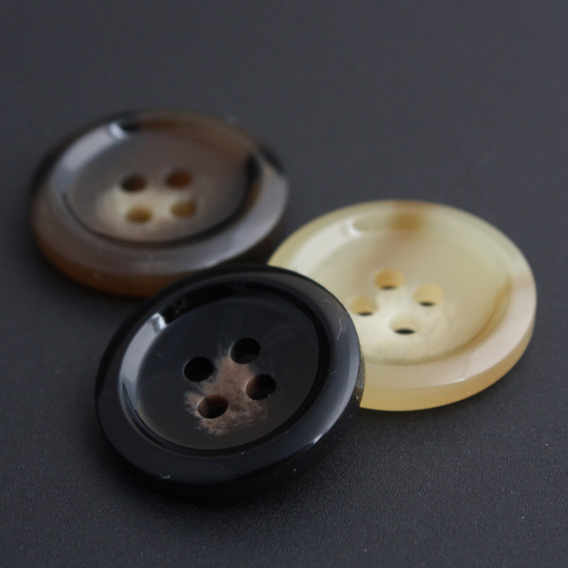 树脂纽扣批发 塑料扣子 大衣钮扣 外套西装通用高档四眼扭扣2128