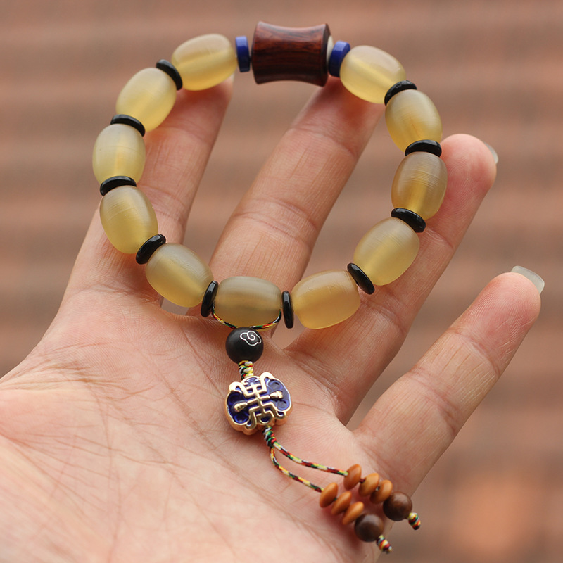 天然羊角手串批发 冰种黄料全透羊角 搭配黄花梨原创羊角饰品代发