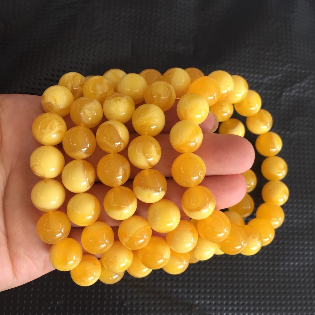 厂家批发二代琥珀蜜蜡鸡油黄飘花蜜蜡手串手链变色蓝珀香味老蜜蜡