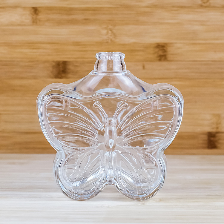 定制批发500ml牙口蝴蝶透明玻璃瓶 生产厂家供应一斤装异形白酒瓶