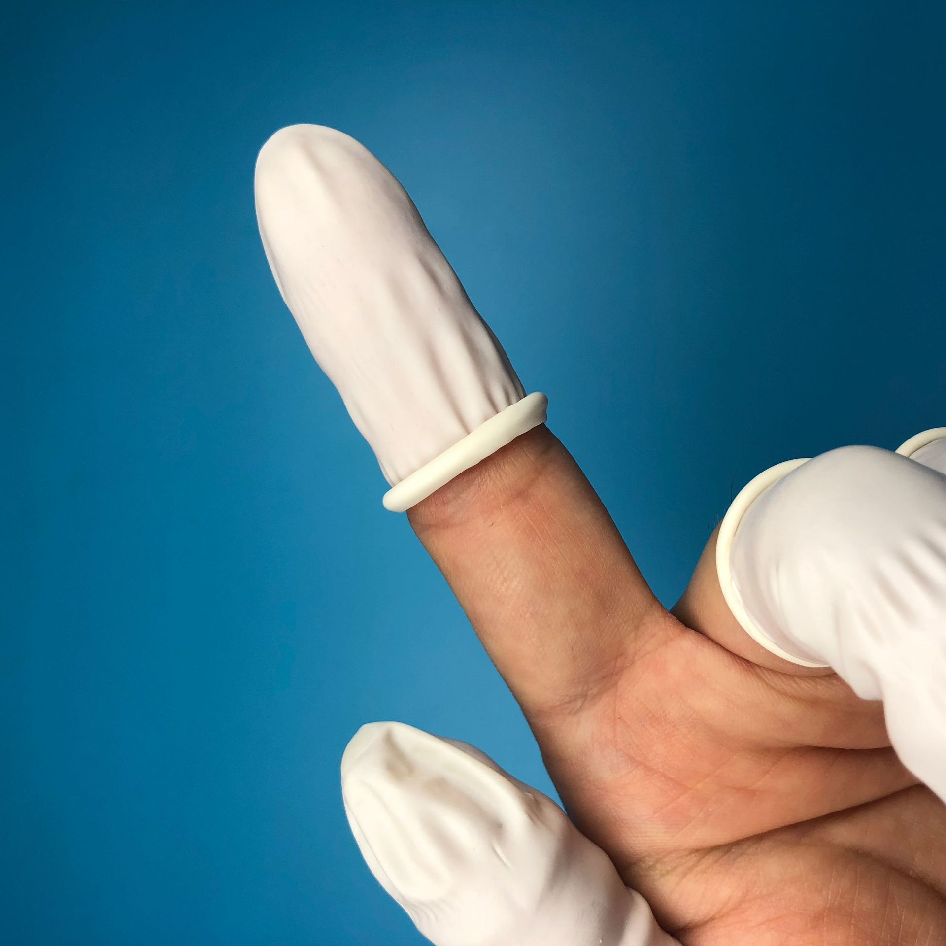 一次性乳胶指套白色无粉纹绣手指套美容美甲胶指套一次性防护指套