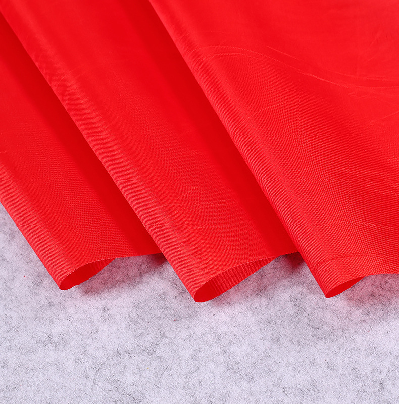 批发喜庆大红绸布剪彩大红花红绸布舞狮腰鼓八美缎布庆典装饰