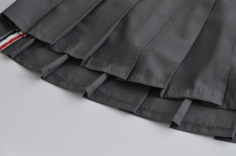 2020新款春装学院风 高腰前短后长a字西装料内衬百褶裙短裙