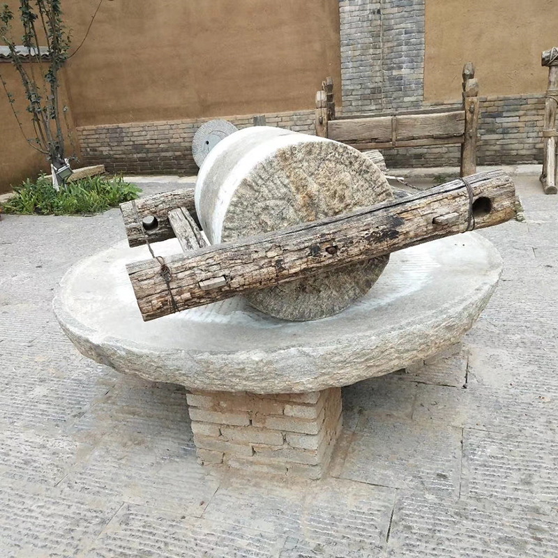 厂家供应石雕做旧青石碾子 旧老磨盘石民间老碾子园林摆件批发