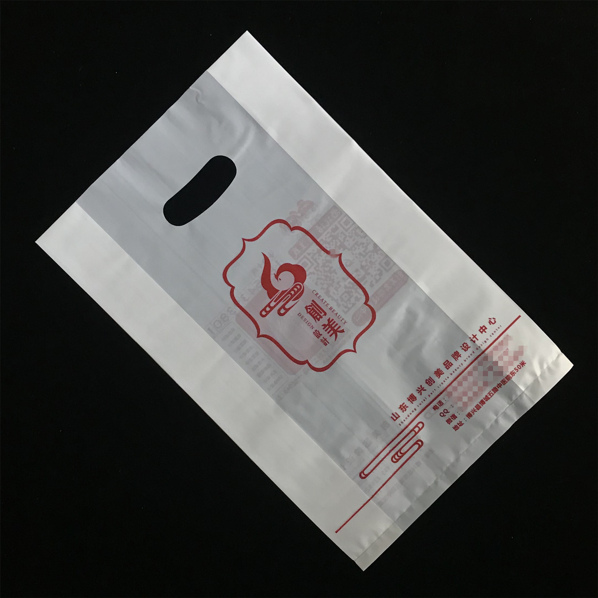 服装广告四指扣手塑料手提袋定做 图文打印店pe手挽袋定制logo