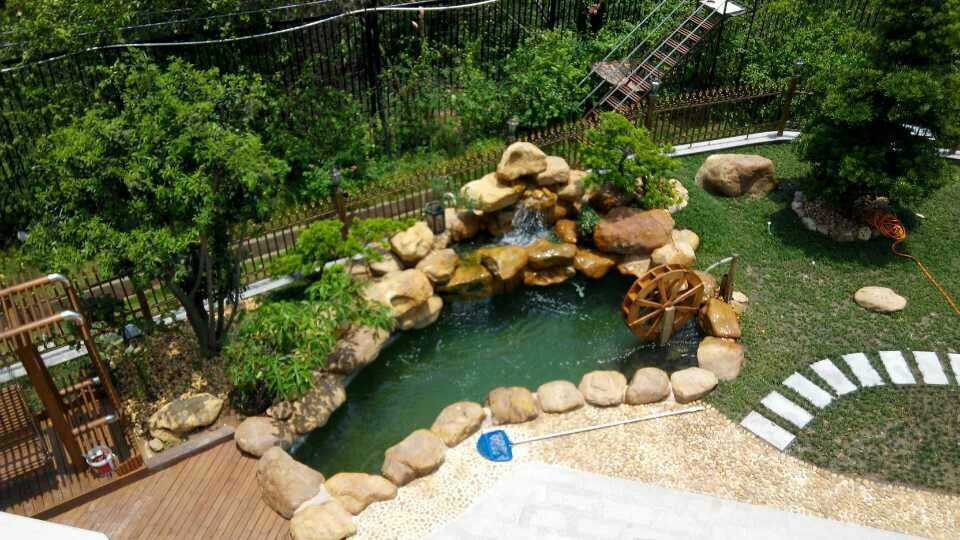 黄蜡石假山石鱼池石驳岸石溪流石假山流水新中式庭院点缀草坪石