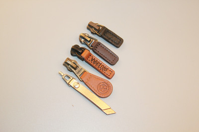 厂家定制 服装箱包真皮皮革拉链头 pu拉头专业生产