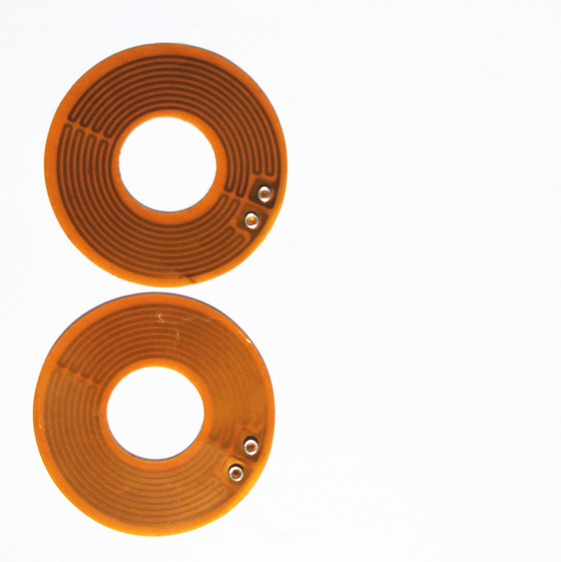 聚酰亚胺薄膜型加热器是一种三明治结构的半透明的金属柔性电加热 