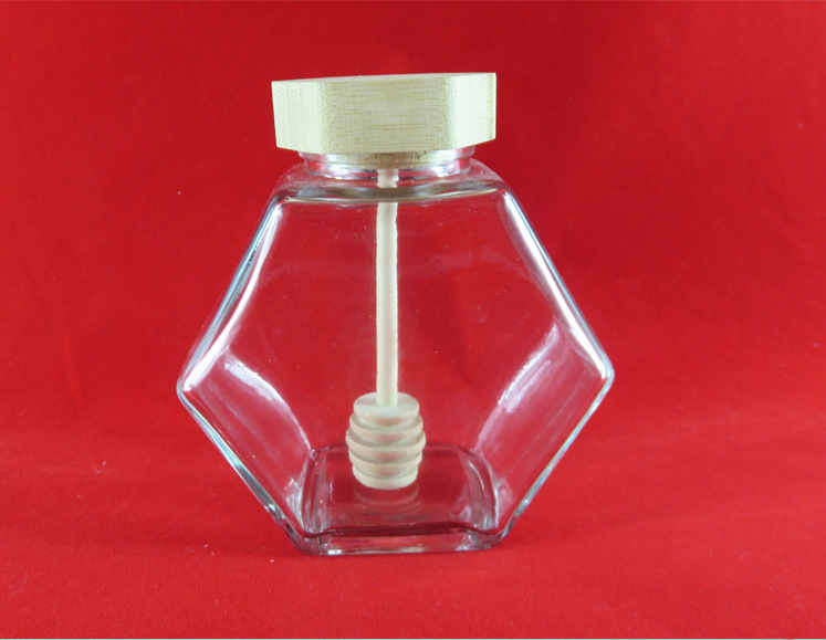 厂家直销六棱玻璃蜂蜜瓶一斤半斤竹木盖蜂巢玻璃瓶带搅拌棒子现货