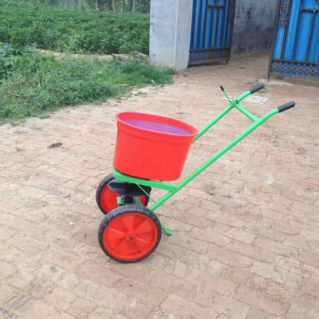 厂家生产直销小型手推式人力撒肥机 高效农用玉米小麦条播播种施肥机