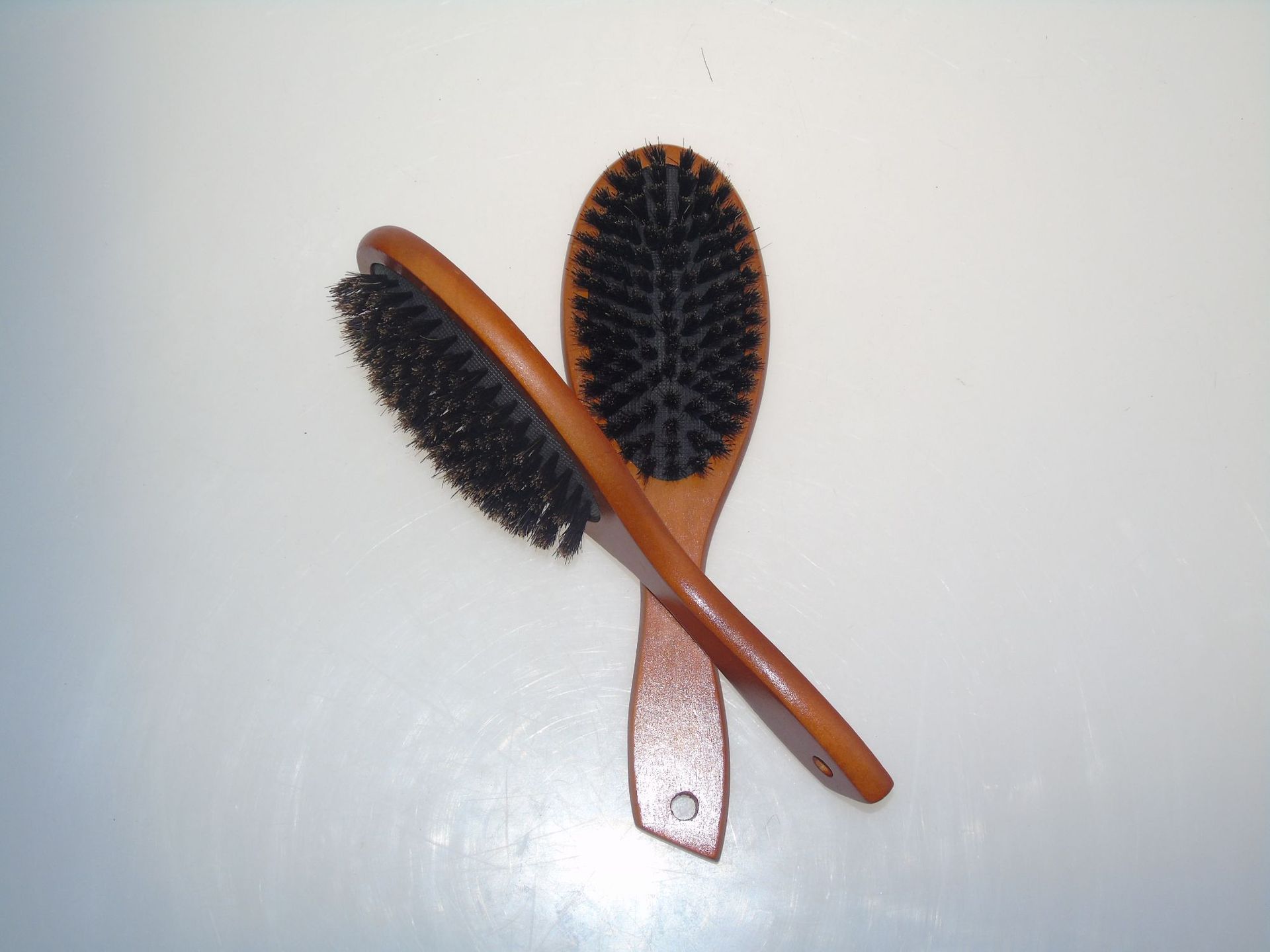 新品上市棕色荷木全猪鬃毛梳子气囊猪鬃木梳子厂家定制生产