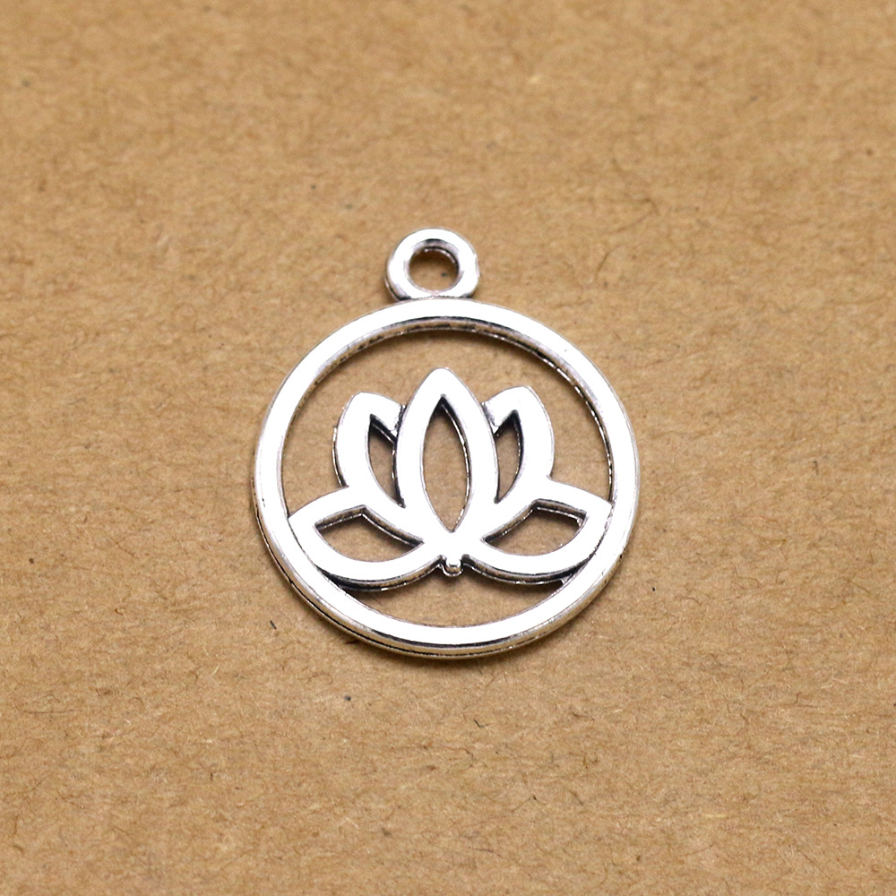 厂家直销 复古合金镂空荷花吊坠 圆形莲花宗教小吊坠 diy饰品配件