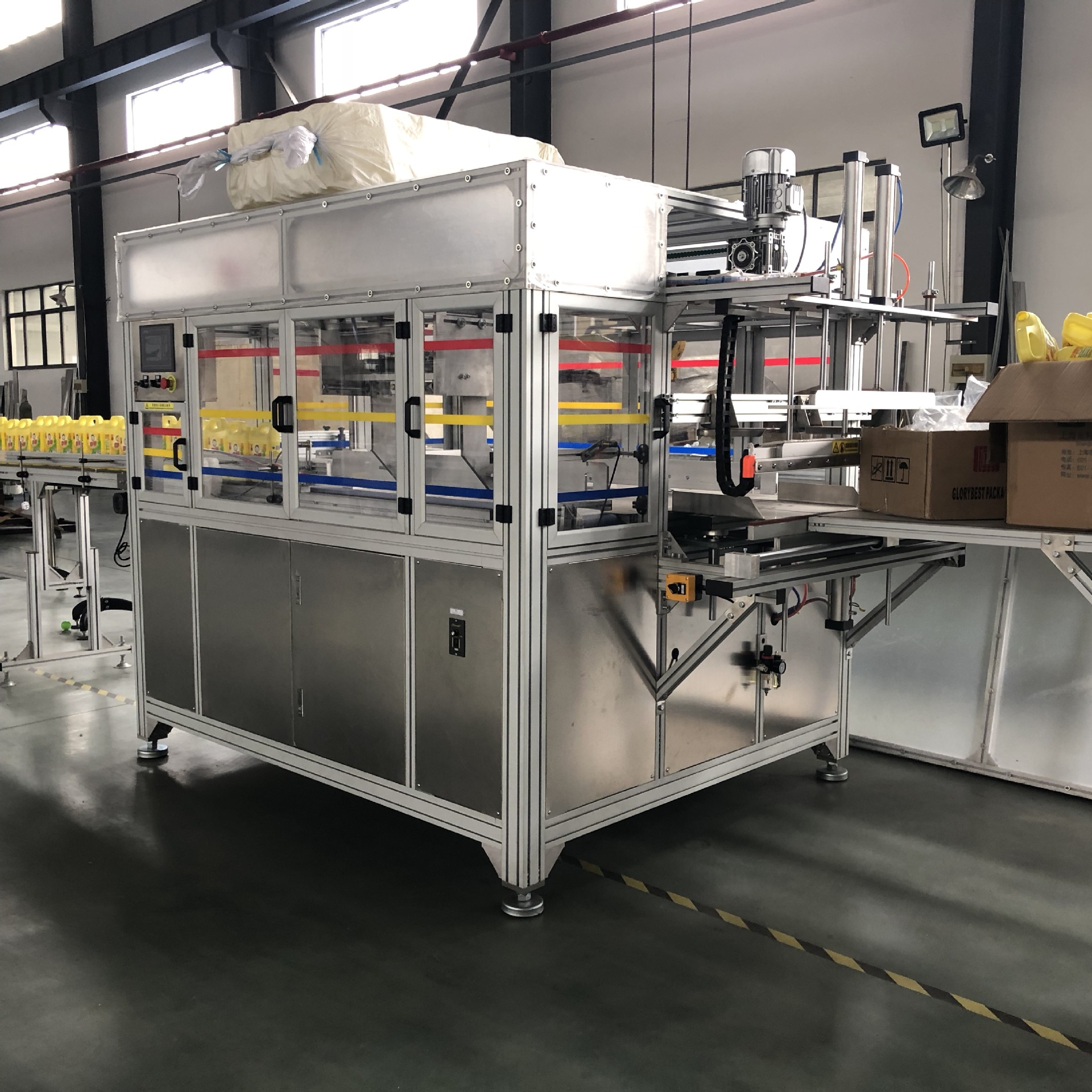 天奇自动化专业生产空洗洁精瓶, 空瓶自动装袋机 自动打包机