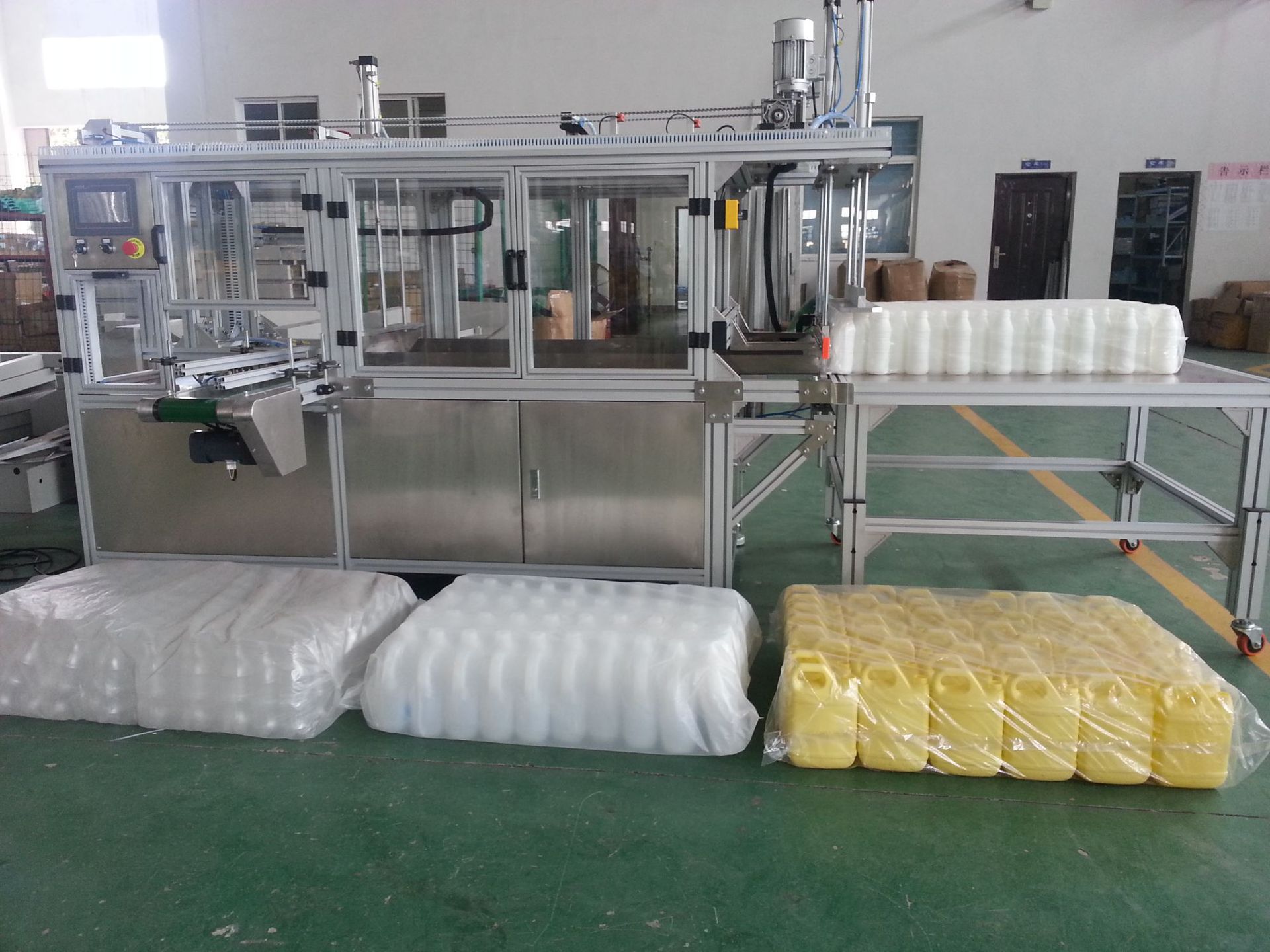 天奇自动化专业生产空洗洁精瓶, 空瓶自动装袋机 自动打包机