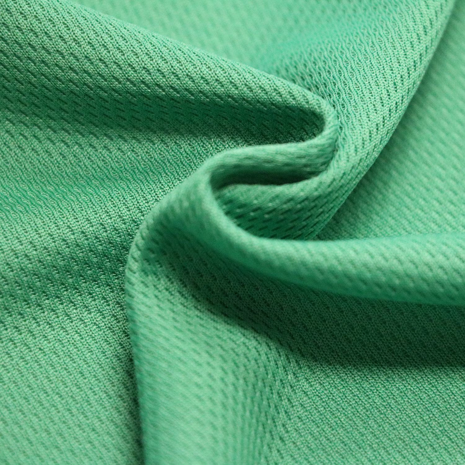 现货供应涤纶面料 100d吸湿速干透气鸟眼布 运动服t恤速干面料