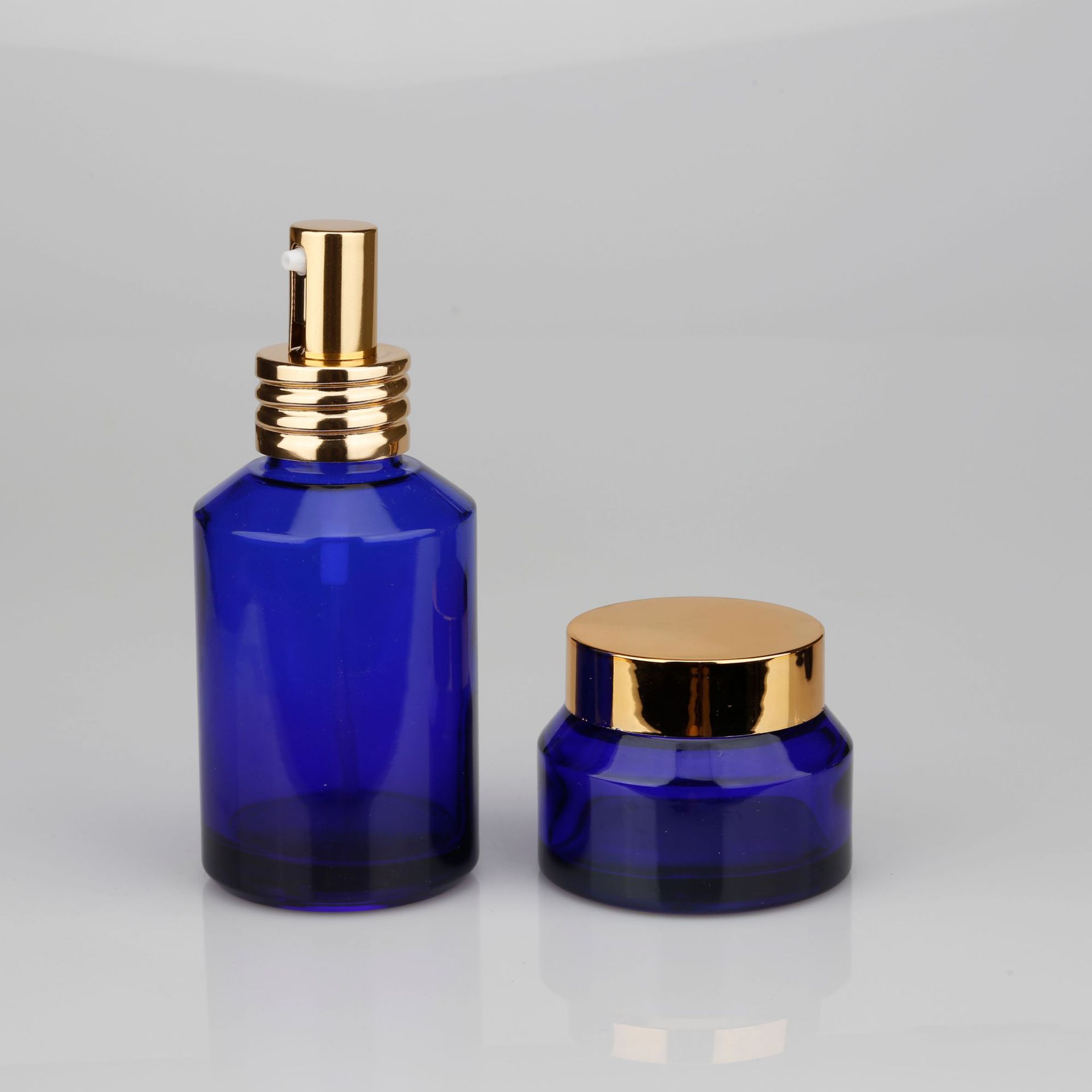 厂家现货本料色蓝色系列斜肩瓶大容量水乳膏霜玻璃瓶100ml60ml50g