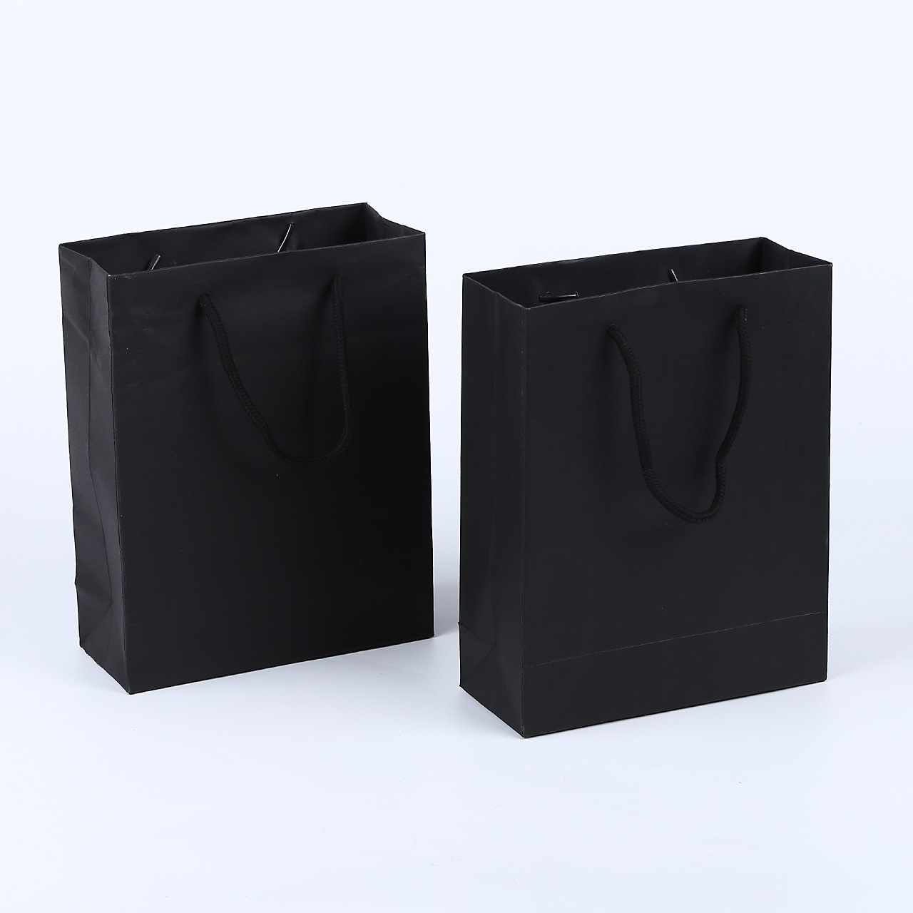 服装手提袋_纸袋白卡纸礼品袋黑色服装购物手提袋环保广告包装袋批发 