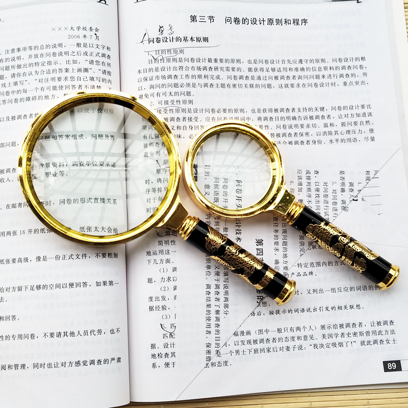 放大镜上写的60mm,请问是什么意思?放大2倍的放大镜写的多少?2倍放大是怎么算出来的?