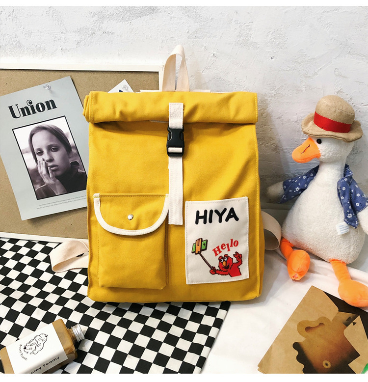 2019冬季新品韩版风范字母印花帆布双肩包个性卷边学生书包