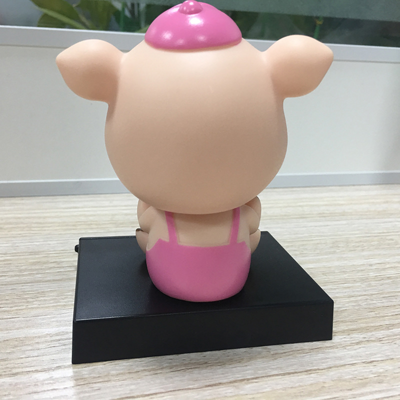 工厂定做供应搪胶公仔 多功能塑胶车载摇头手机座摆件猪年吉祥物