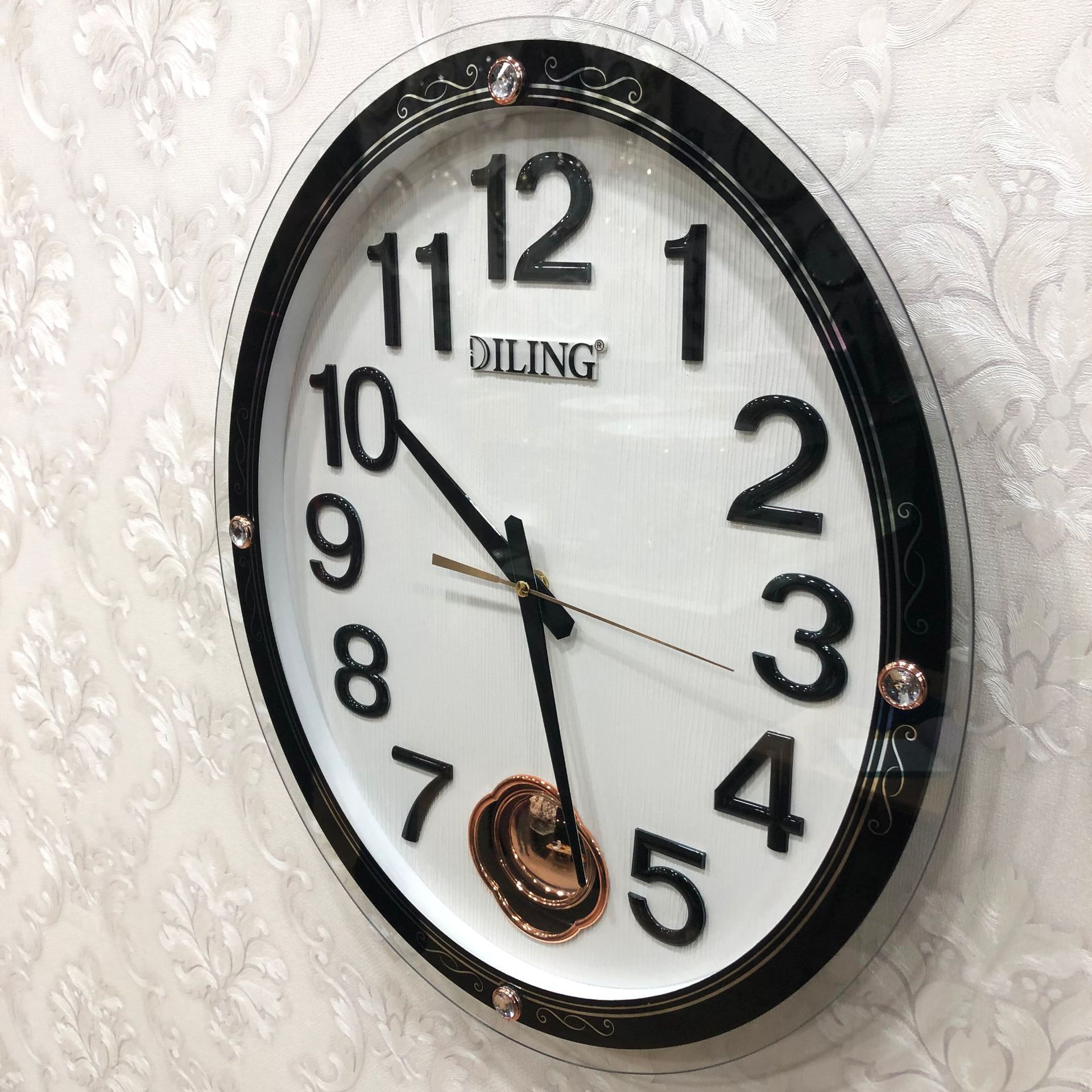 迪翎1919椭圆吊摆金字木纹盘面玻璃框石英挂钟